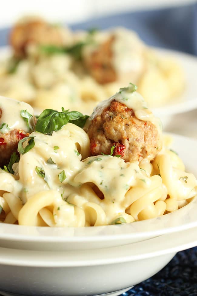 Ricotta Meatballs with Sun-Dried Tomatoes and Garlic Asiago Cream Sauce | The Suburban Soapbox #meatballs #maggianos