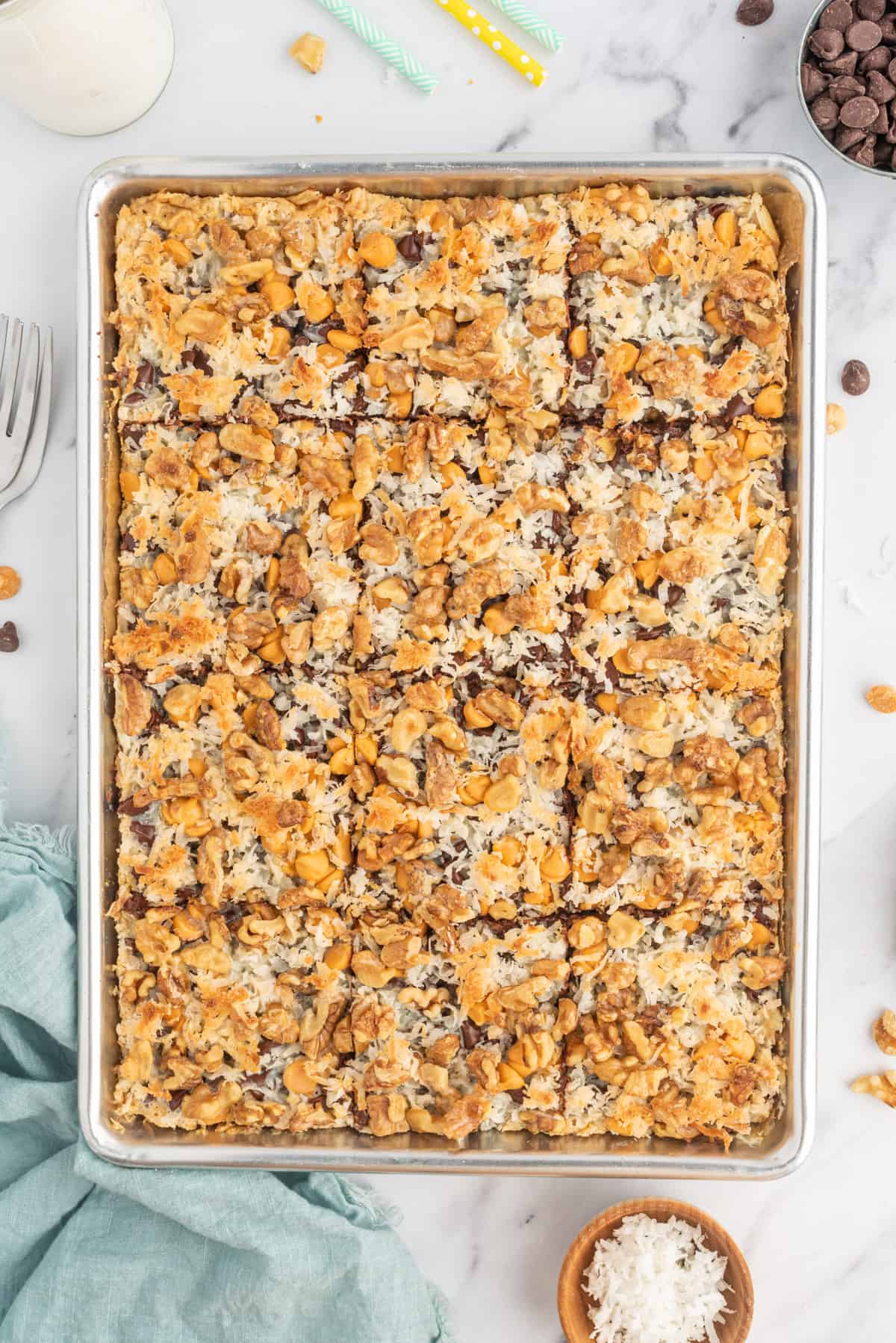 A baking dish is filled with slices bars. 
