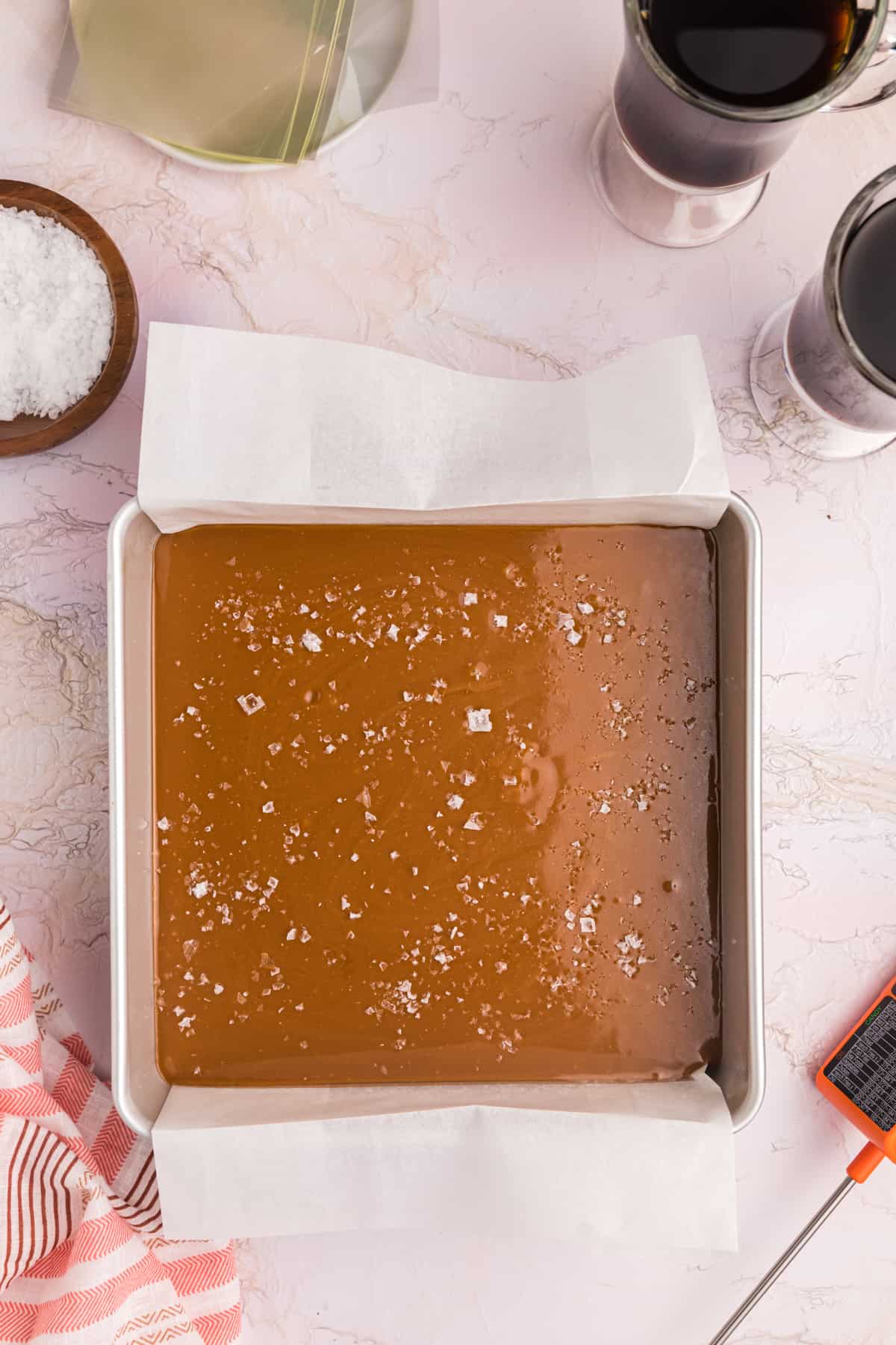 A pan is filled with uncut caramel.