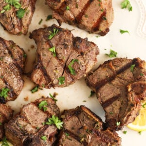 Overhead view of grilled lamb loin chops on platter