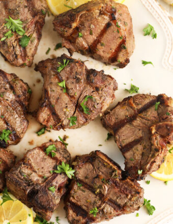 Overhead view of grilled lamb loin chops on platter