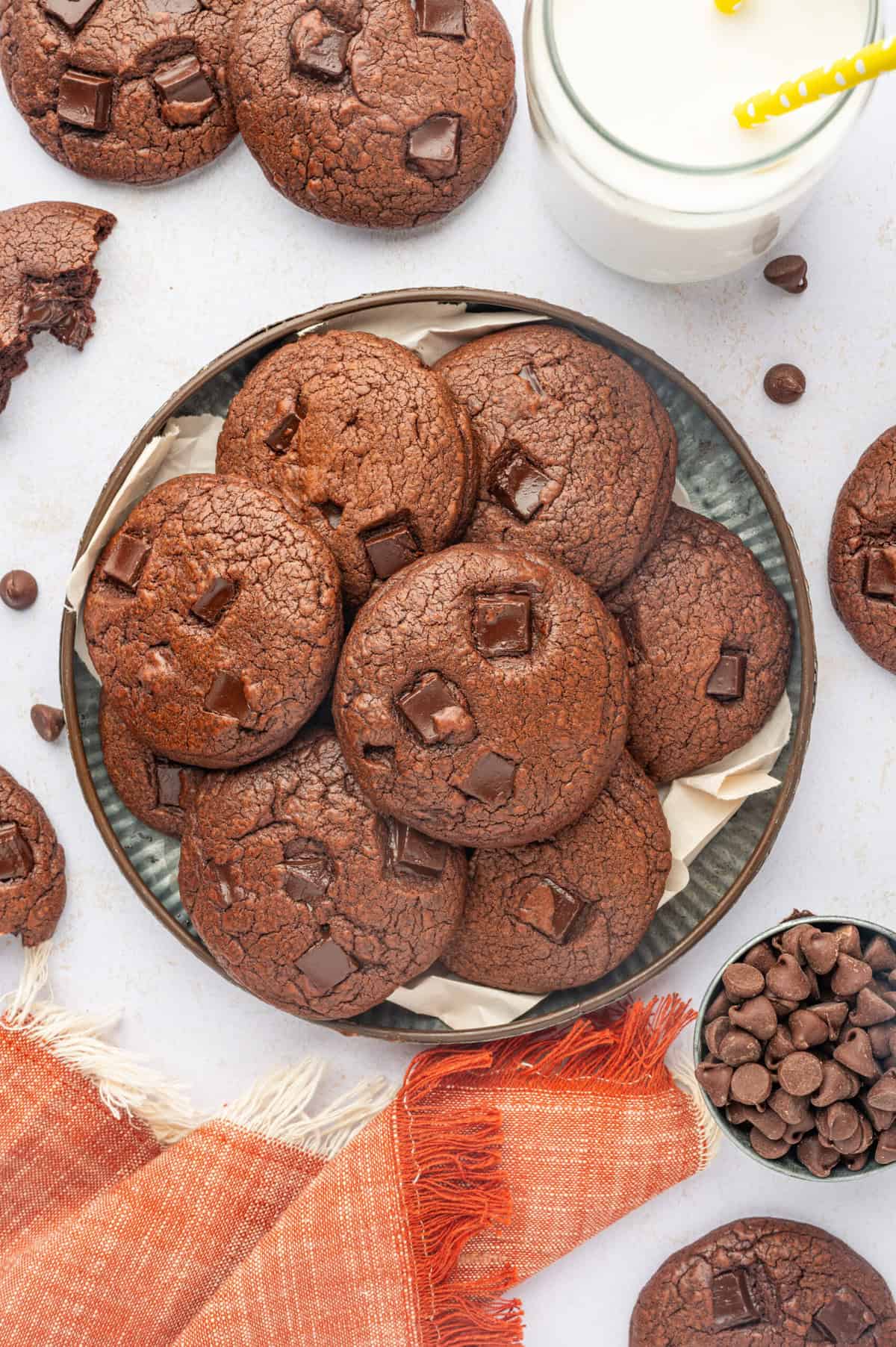 Overhead view of double chocolate chip cookies piled on plate