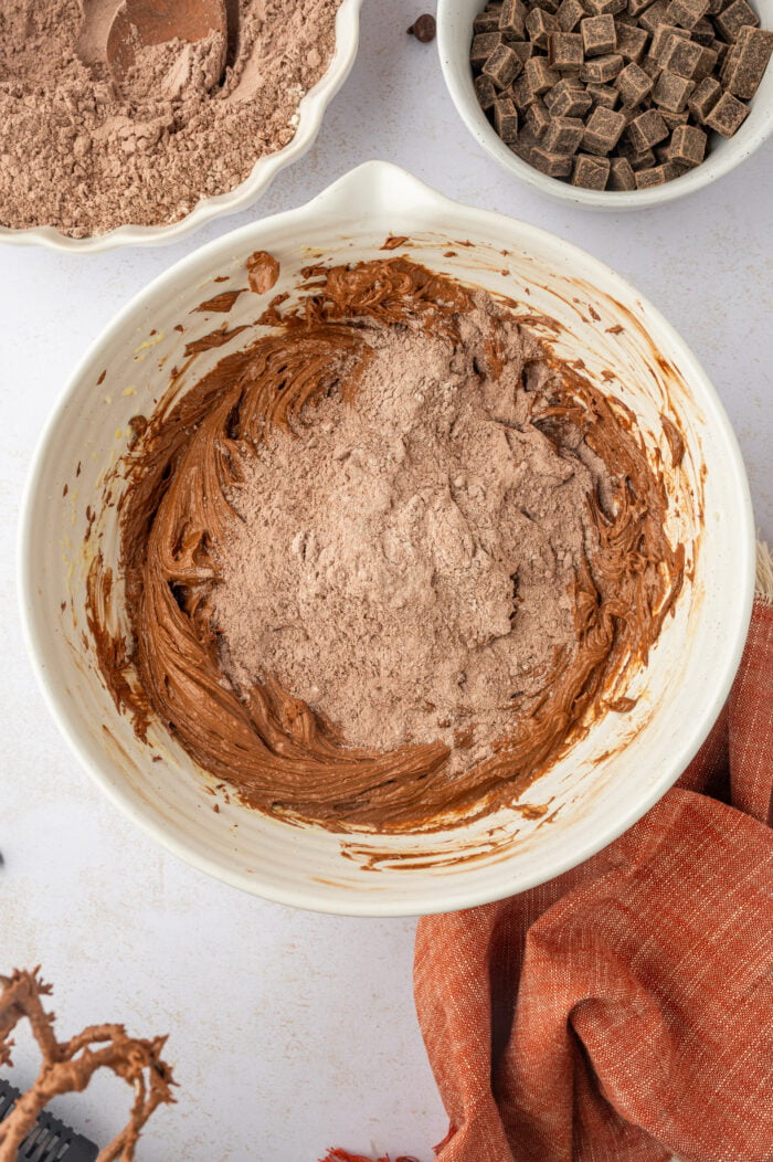 Dry ingredients added to wet ingredients for double chocolate chip cookies