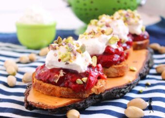 Roasted Balsamic Strawberry Crostini with Mascarpone Whipped Cream and Pistachios