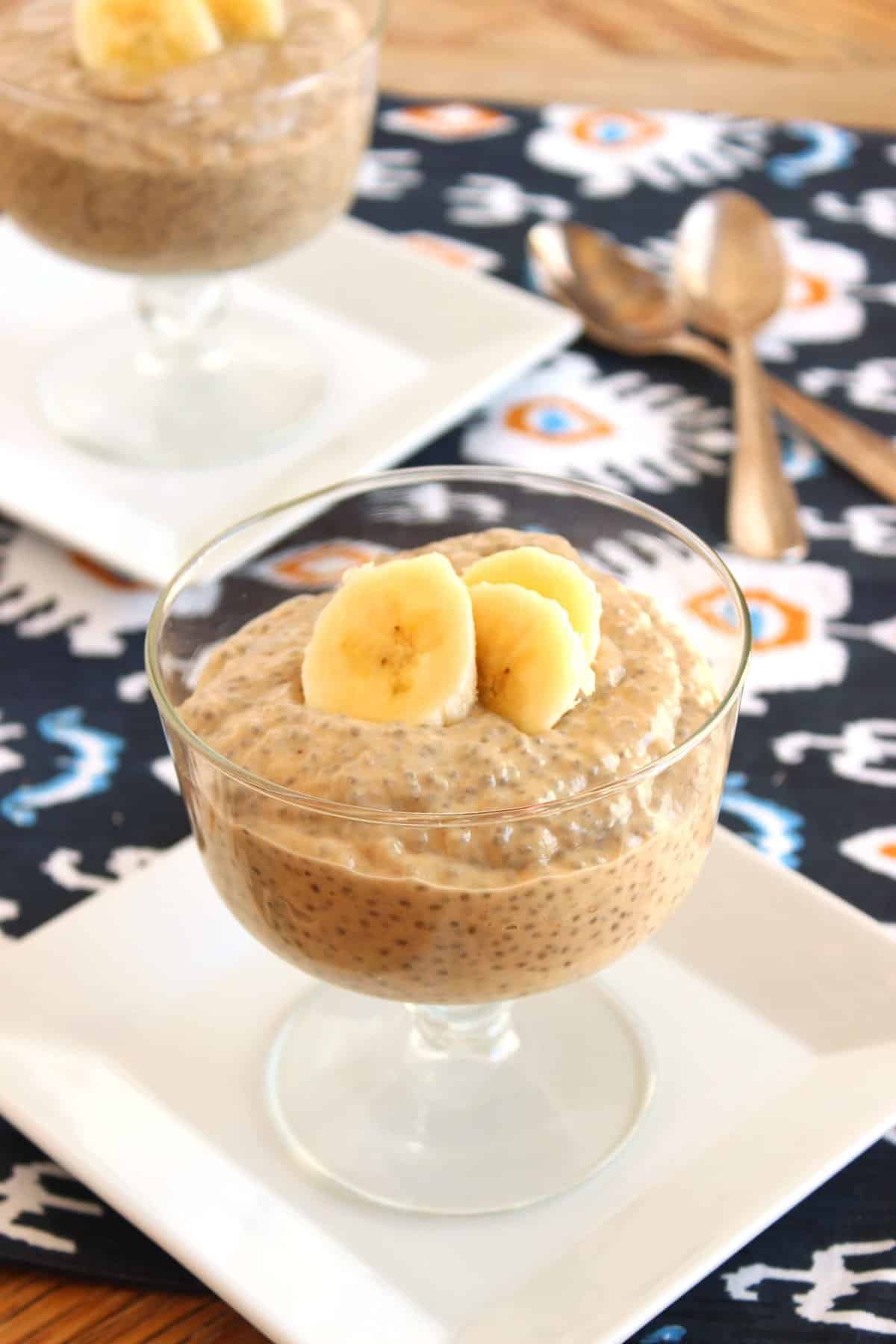 Banana Peanut Butter Chia Seed Pudding in a footed dessert bowl.