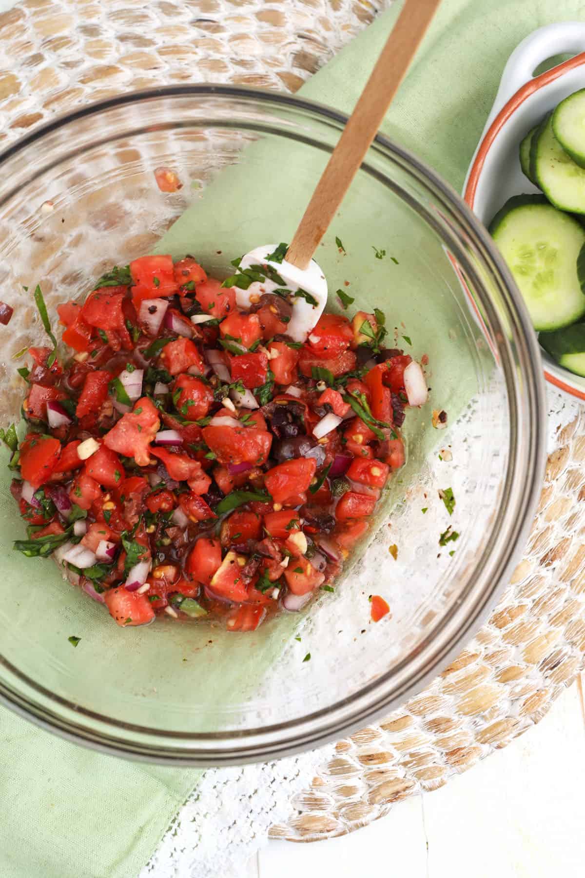 Cucumber bruschetta mixture in glass bowl