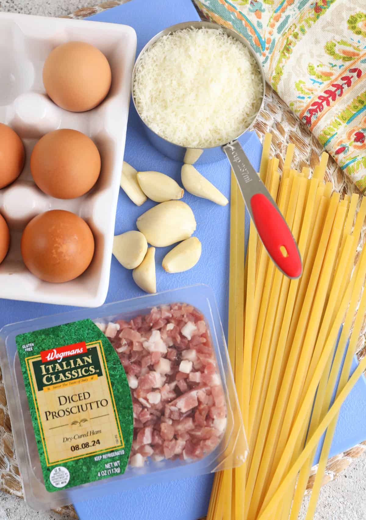 Overhead view of ingredients for pasta carbonara