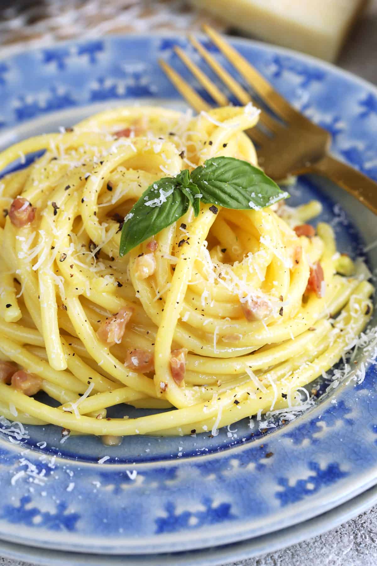 Pasta carbonara in bowl with fork