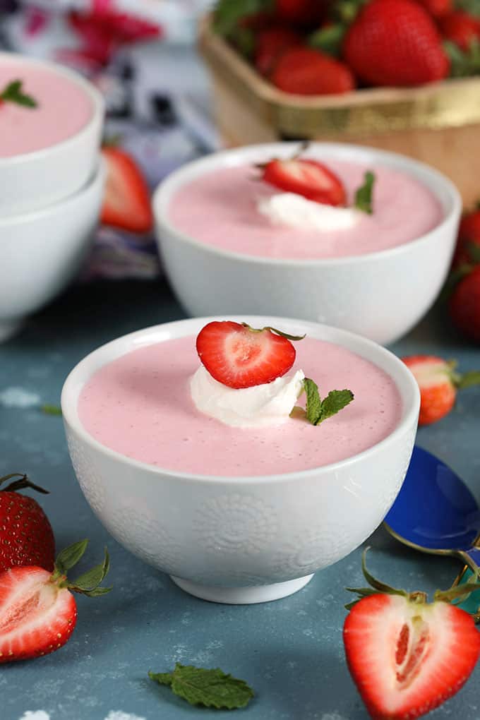 Strawberry Soup in a white bowl with a blue background from Thesuburbansoapbox.com