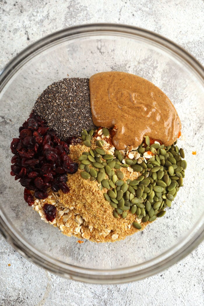 Ingredients for pumpkin energy bites in mixing bowl