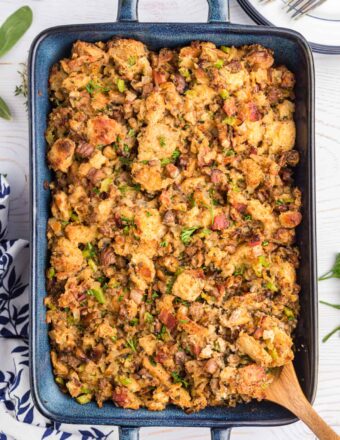 A large baking dish is filled with chestnut sausage stuffing.