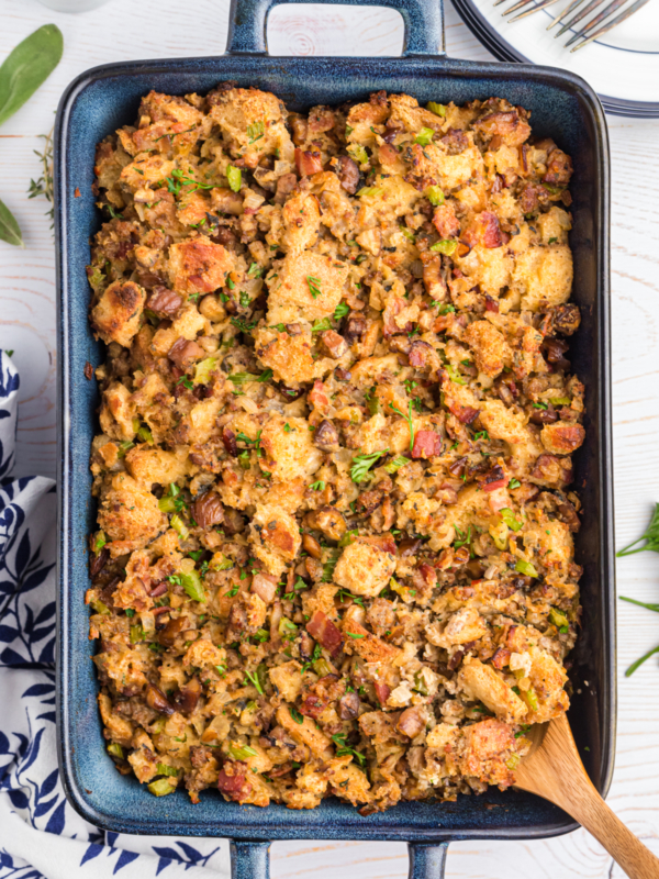 A large baking dish is filled with chestnut sausage stuffing.