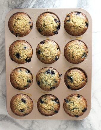 blueberry muffins in a muffin tin.