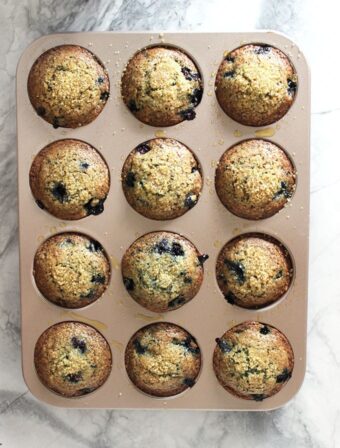 blueberry muffins in a muffin tin.