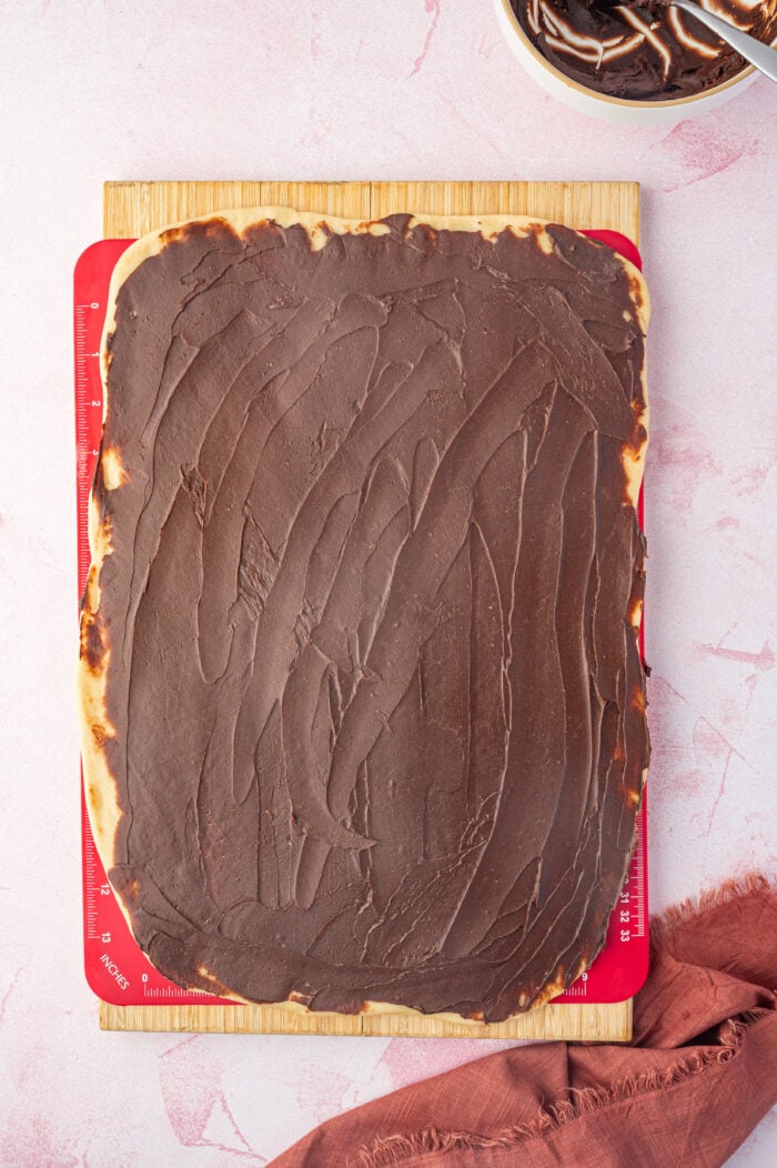 Overhead view of chocolate filling spread onto babka dough