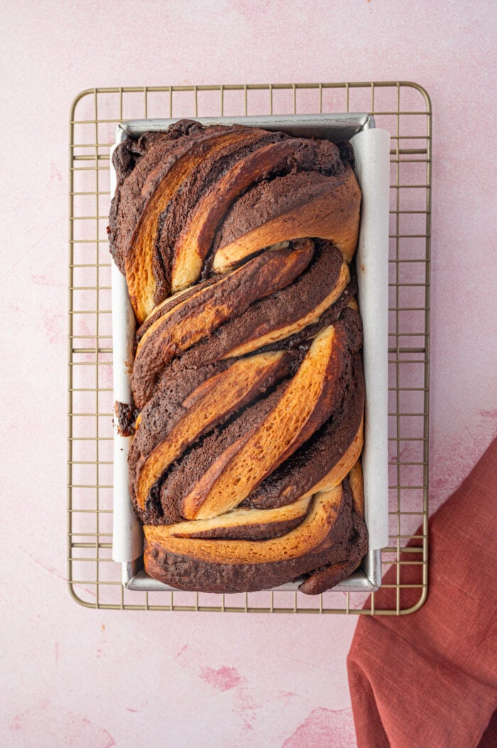 Overhead view of baked chocolate babka in pan