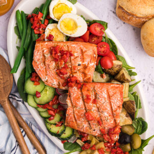Grilled Salmon on a platter with Nicoise Salad