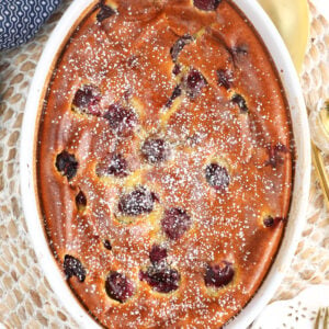 Overhead view of cherry clafoutis dusted with powdered sugar