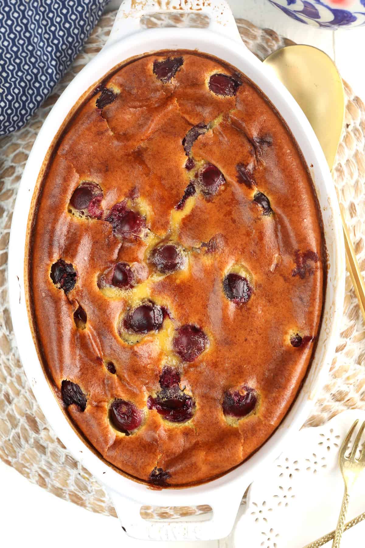 Overhead view of baked cherry clafoutis in dish