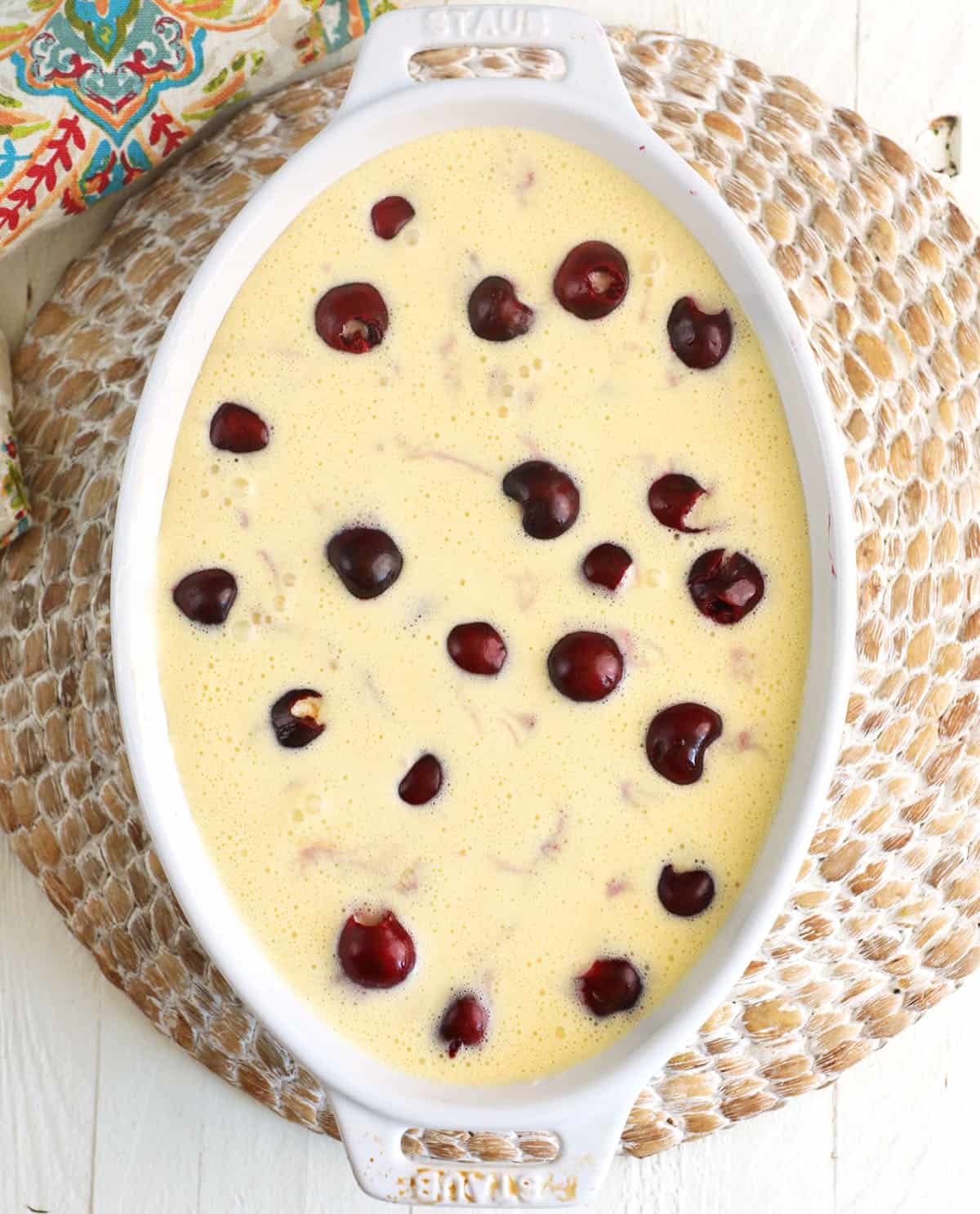 Overhead view of cherry clafoutis in dish before baking