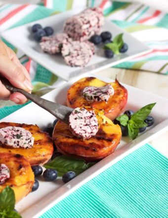 A quick and easy Grilled Peach recipe topped with an easy to make blueberry basil butter from TheSuburbanSoapbox.com.