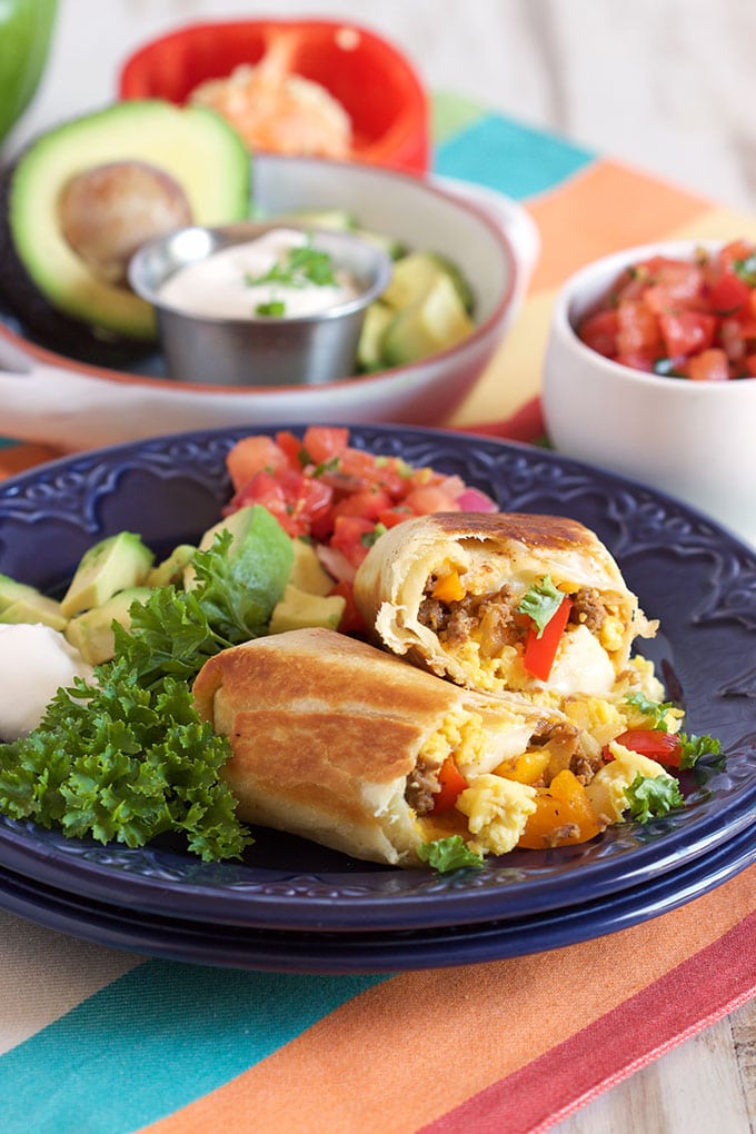 Chorizo and eggs burrito on a blue plate