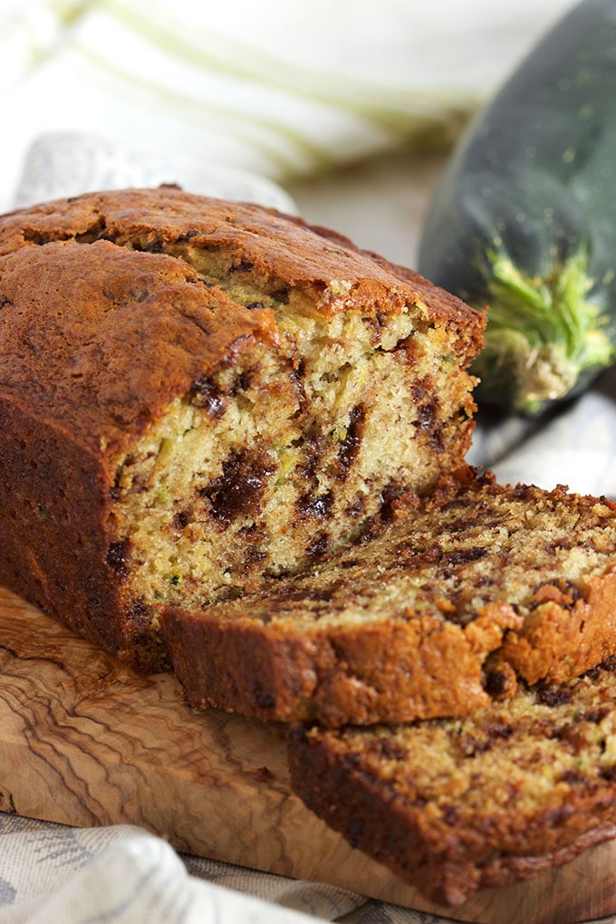 This super easy Zucchini Banana Bread recipe is studded with mini chocolate chips for a decadent sweet treat that's no short of addicting. TheSuburbanSoapbox.com