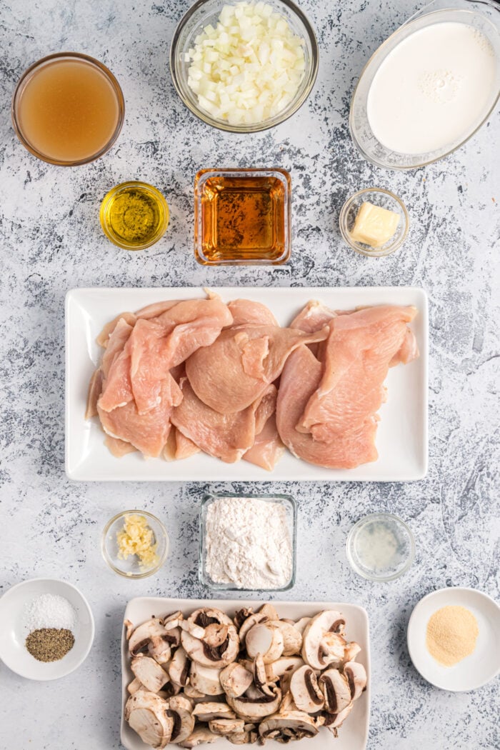 The ingredients for chicken marsala are placed on a countertop.