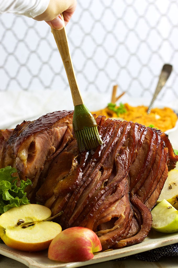 So easy to make, this Bourbon Honey Baked Ham recipe is better than the original and perfect for any holiday! | TheSuburbanSoapbox.com