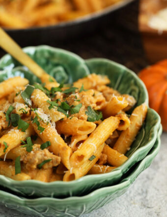 Pumpkin pasta in bowl with fork