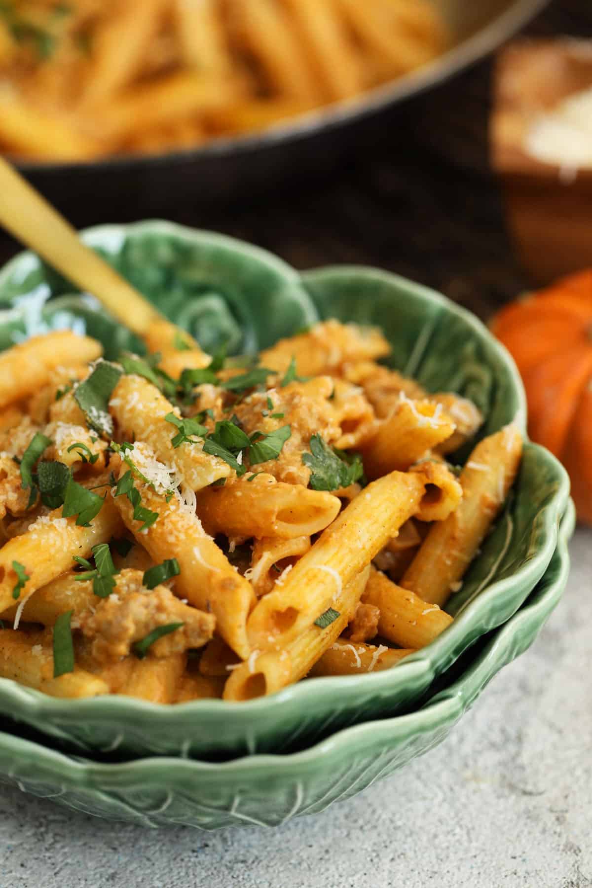 Pumpkin pasta in bowl with fork