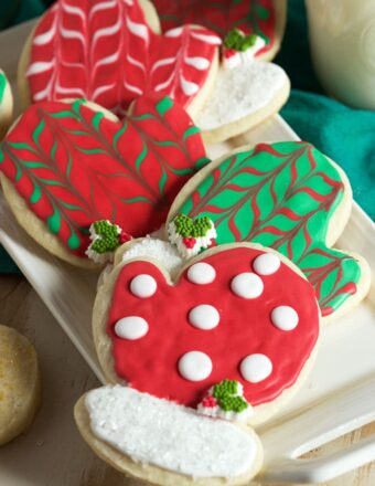 Christmas Sugar Cookies shaped like mittens and decorated with polka dots and stripes.