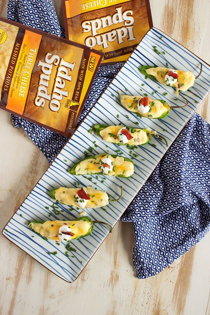 A tasty twist on a classic, Loaded Baked Potato Jalapeño Poppers are the perfect tailgating snack. Easy and quick! | TheSuburbanSoapbox.com