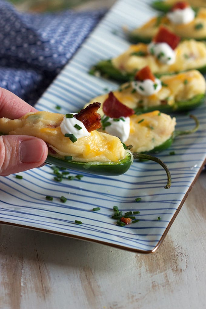 A tasty twist on a classic, Loaded Baked Potato Jalapeño Poppers are the perfect tailgating snack. Easy and quick! | TheSuburbanSoapbox.com