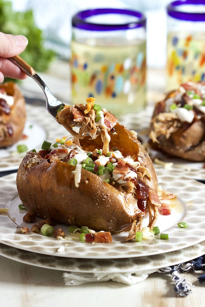 Super easy to make Loaded Pulled Pork Stuffed Sweet Potatoes are a quick easy weeknight dinner solution! | TheSuburbanSoapbox.com