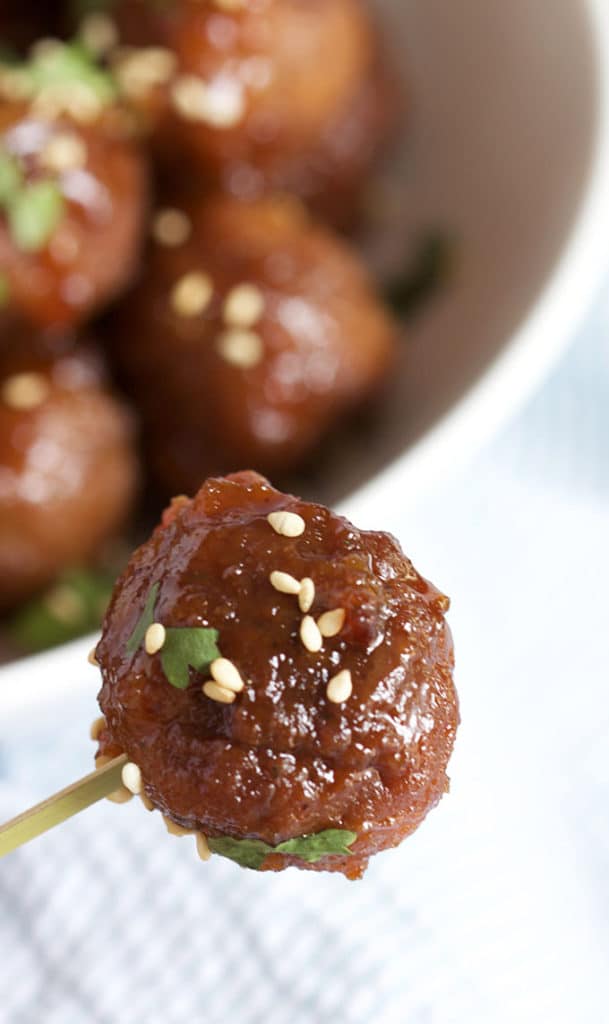 Super easy to make Slow Cooker Spicy Orange Marmalade Meatball recipe is the perfect addition to any game day spread! | TheSuburbanSoapbox.com