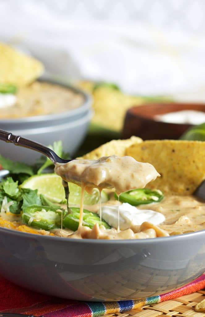 Ready in just 30 minutes with slow simmered flavor, this is the BEST Creamy White Chicken Chili Recipe ever. | TheSuburbanSoapbox.com