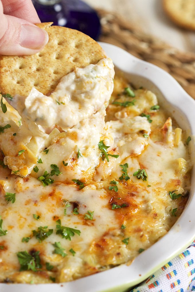 Ready in minutes and the perfect party starter, this Hot Artichoke Asiago Dip recipe is a win with every guest! | TheSuburbanSoapbox.com