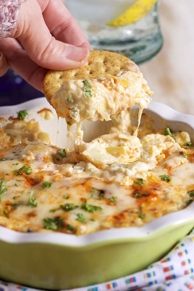 Ready in minutes and the perfect party starter, this Hot Artichoke Asiago Dip recipe is a win with every guest! | TheSuburbanSoapbox.com