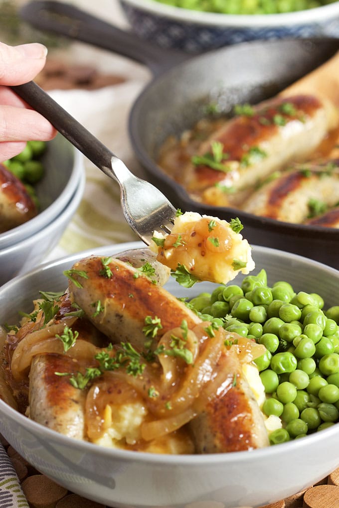 Super easy to make, Bangers and Mash with Onion Mustard Gravy is the best comfort food recipe around. Ready in less than 30 minutes. | TheSuburbanSoapbox.com