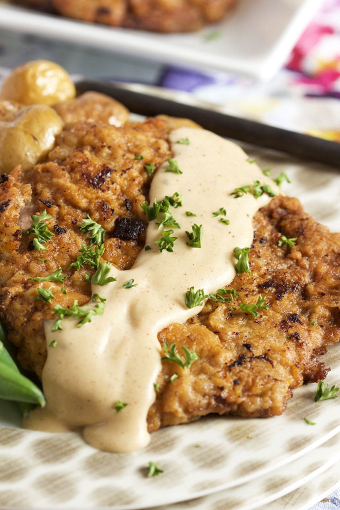 Ready in 30 minutes, this easy Chicken Fried Steak with Country Gravy recipe is a family favorite. | TheSuburbanSoapbox.com
