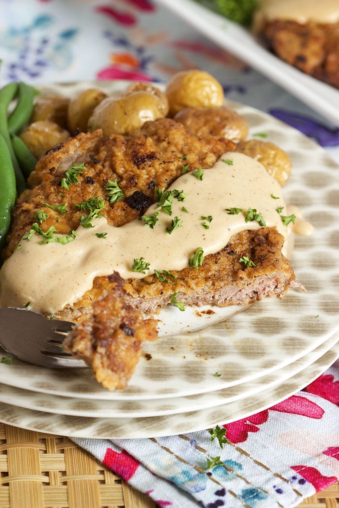 Ready in 30 minutes, this easy Chicken Fried Steak with Country Gravy recipe is a family favorite. | TheSuburbanSoapbox.com