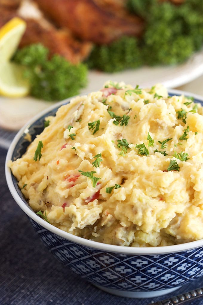 Pimento cheese mashed potatoes in a blue and white bowl.