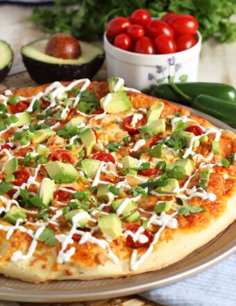 The best way to celebrate Pizza Friday and Cinco de Mayo, this Easy Chicken Enchilada Pizza recipe is ready in just 20 minutes! | TheSuburbanSoapbox.com