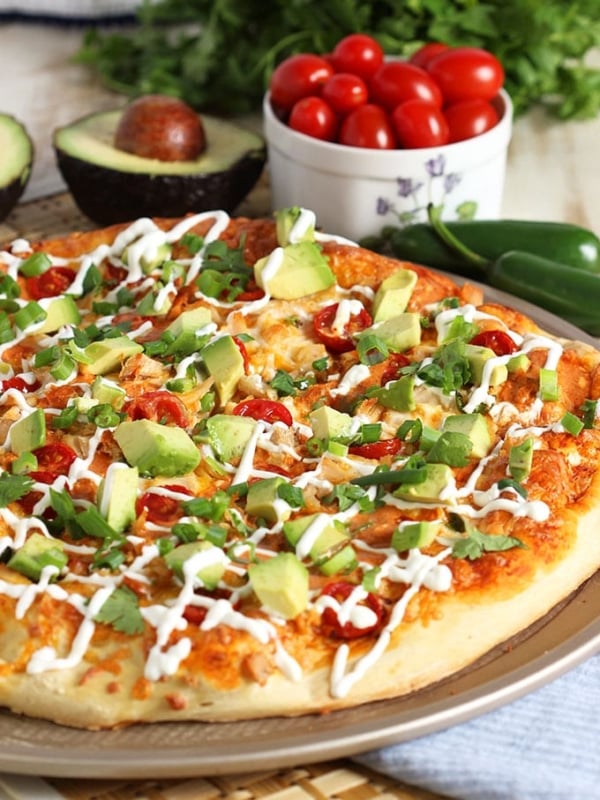 The best way to celebrate Pizza Friday and Cinco de Mayo, this Easy Chicken Enchilada Pizza recipe is ready in just 20 minutes! | TheSuburbanSoapbox.com