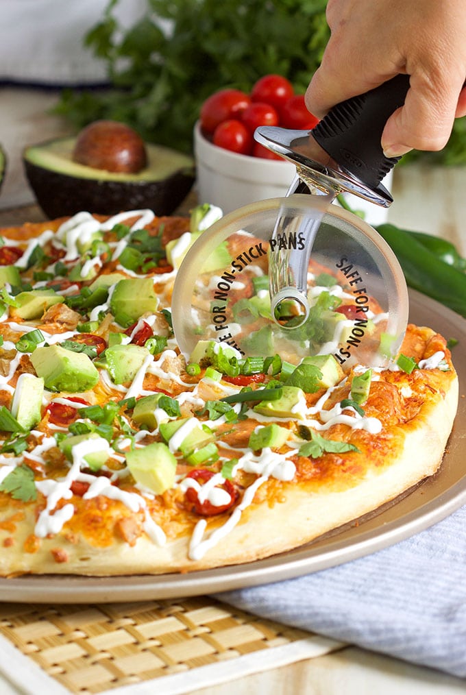 The best way to celebrate Pizza Friday and Cinco de Mayo, this Easy Chicken Enchilada Pizza recipe is ready in just 20 minutes! | TheSuburbanSoapbox.com