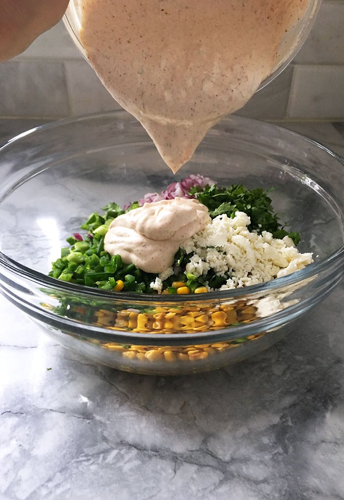 Quick and easy, Mexican Street Corn Salad is a fresh and bright side dish perfect for summer parties and Cinco de Mayo. | TheSuburbanSoapbox.com