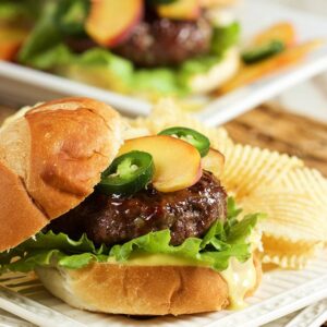 A savory and sweet combo everyone will love, this Peach Glazed Blue Cheese Burger will be the hit of your summer cookout or tailgate! | TheSuburbanSoapbox.com