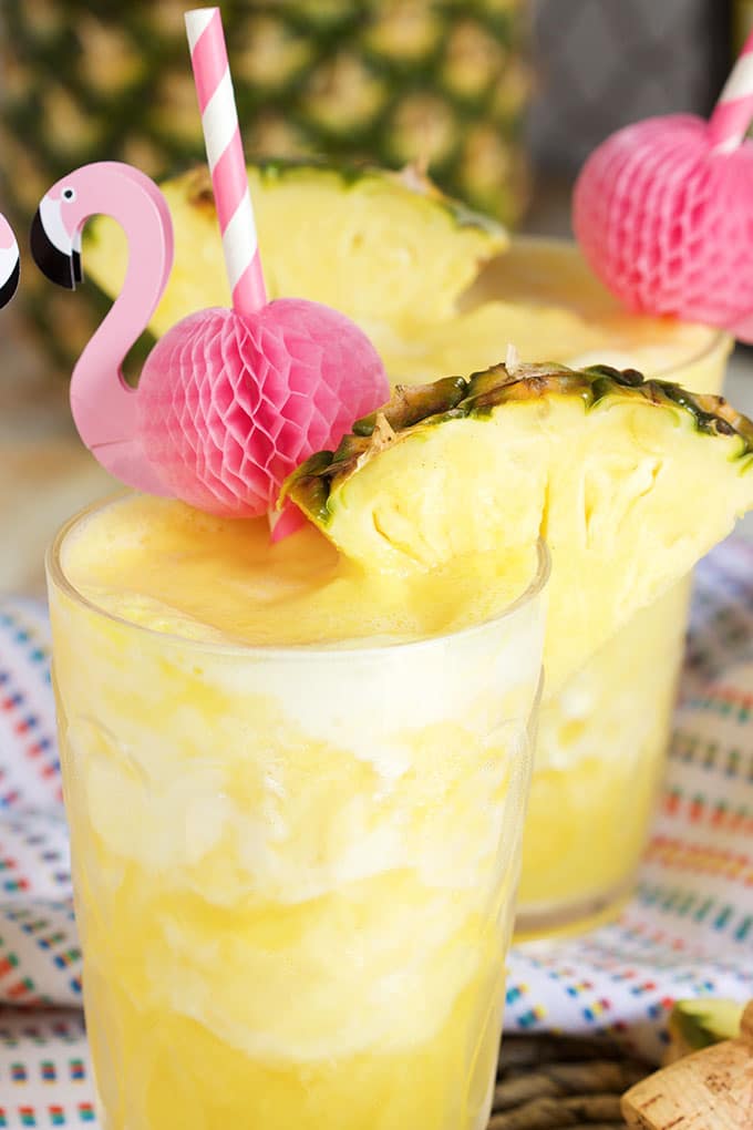 Two ingredients, one minutes, the perfect party cocktail...Pineapple Prosecco Slushie is the best beverage for summer! | TheSuburbanSoapbox.com