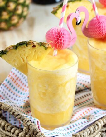 Two ingredients, one minutes, the perfect party cocktail...Pineapple Prosecco Slushies are the best beverage for summer! | TheSuburbanSoapbox.com